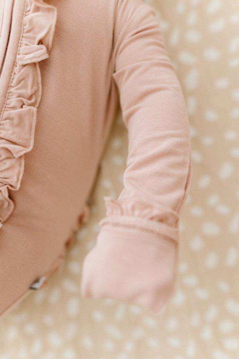 Dusty pink ruffle zipper one piece made from bamboo viscose with fold over cuffs.