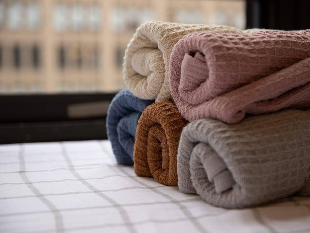 Crover 100% cotton waffle baby blanket for swaddling and stroller coverage.