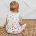 Sleeveless baby shortall with a carrot print, shoulder snaps, and snap closures along the legs.