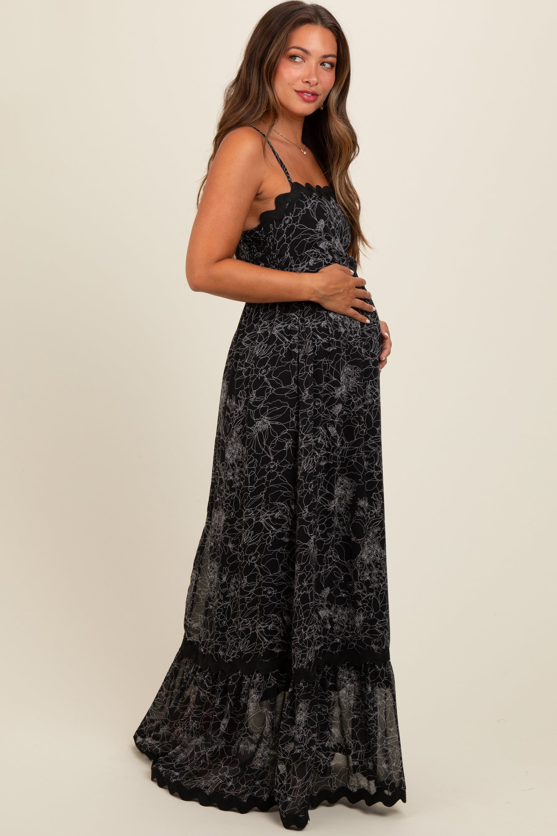 PinkBlush Black Floral Contrast Trim Maternity Maxi Dress worn by a pregnant model.