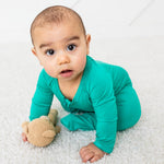 Emerald green footie pajamas with a full-length front zipper and fold-over hand mittens.