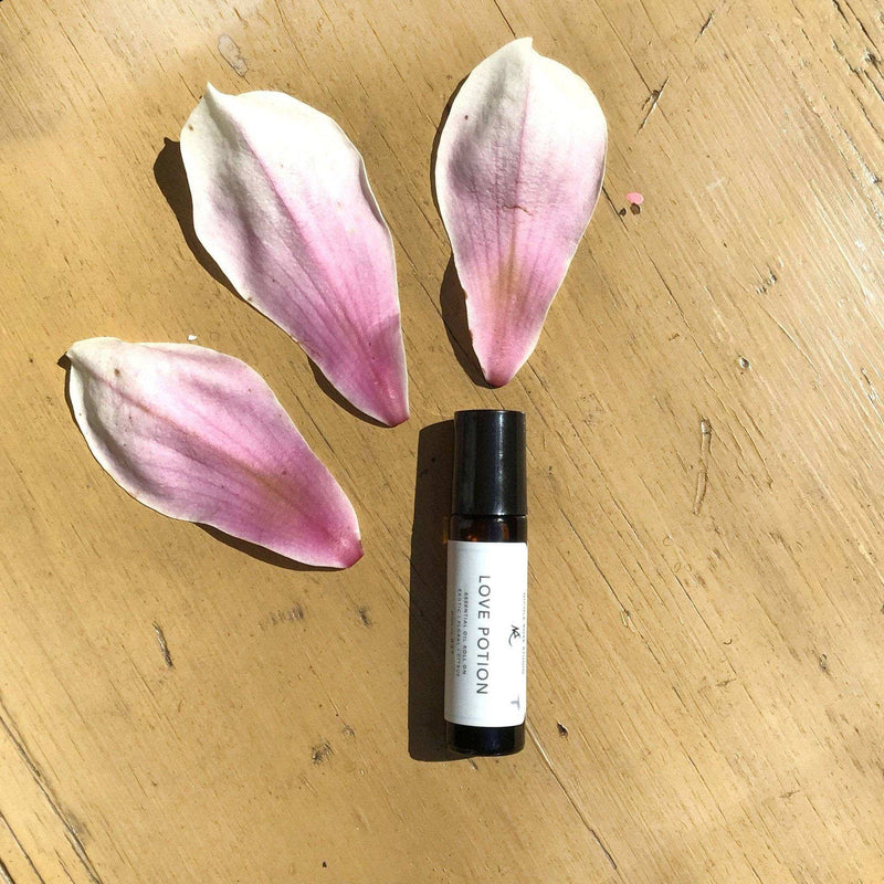 Essential Oil Roll On with floral and citrus scent, featuring Ylang-ylang, Lemon, Orange, and Lavender oils.