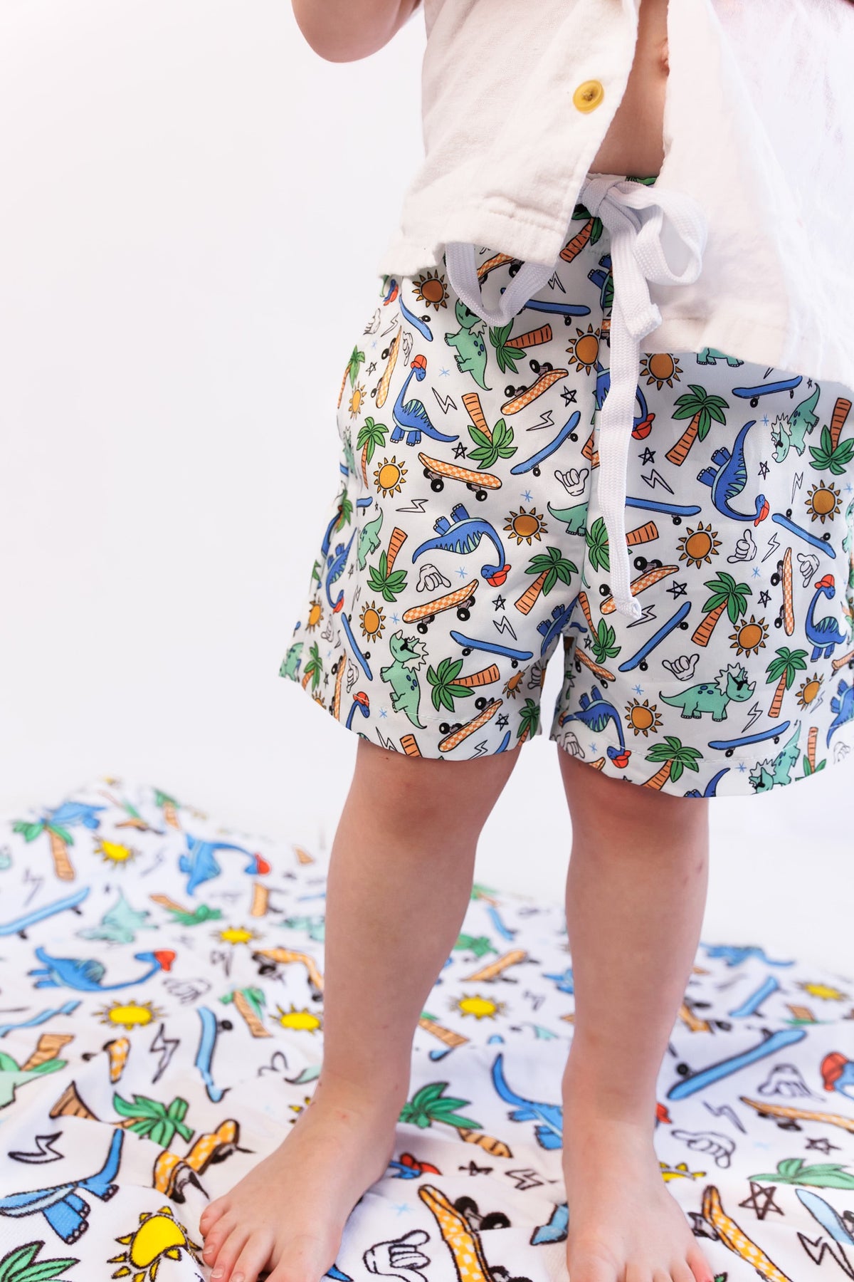 DREAM BIG LITTLE CO EXCLUSIVE SURF - O - SAURUS DREAM SWIM TRUNKSEveretts Place
