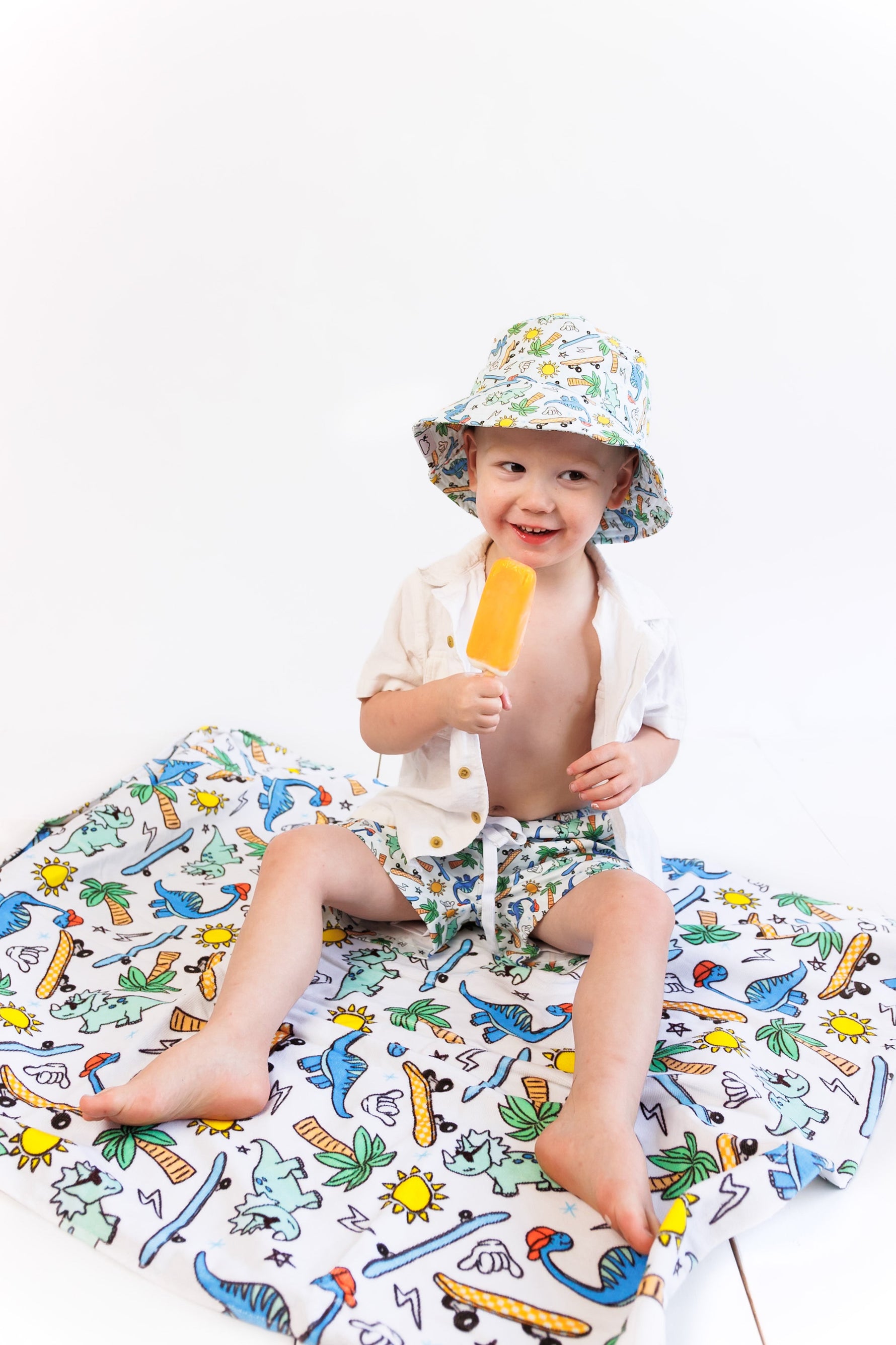 DREAM BIG LITTLE CO EXCLUSIVE SURF - O - SAURUS DREAM SWIM TRUNKSEveretts Place