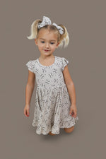 DREAM BIG LITTLE CO EXCLUSIVE SWING FOR THE STARS DREAM CAP SLEEVE RUFFLE DRESSEveretts Place