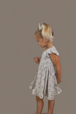 DREAM BIG LITTLE CO EXCLUSIVE SWING FOR THE STARS DREAM CAP SLEEVE RUFFLE DRESSEveretts Place