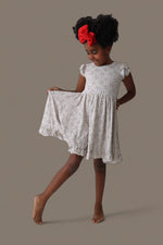 DREAM BIG LITTLE CO EXCLUSIVE SWING FOR THE STARS DREAM CAP SLEEVE RUFFLE DRESSEveretts Place
