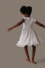 DREAM BIG LITTLE CO EXCLUSIVE SWING FOR THE STARS DREAM CAP SLEEVE RUFFLE DRESSEveretts Place