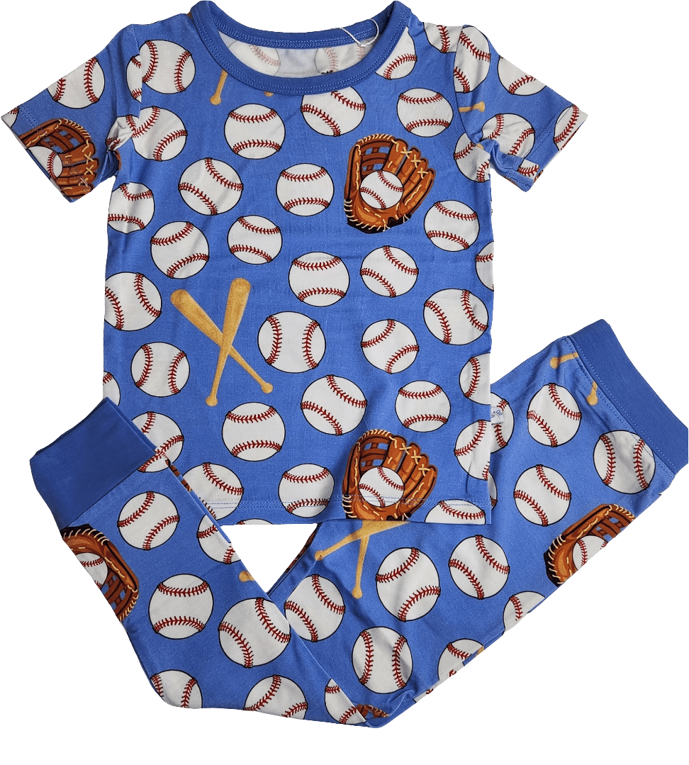 Two-piece toddler pajama set with long-sleeve top and long pants in an eye-on-the-ball ball print
