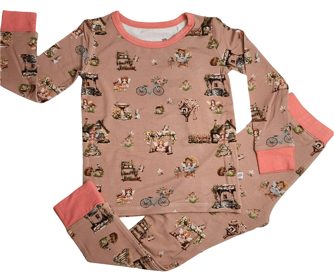 Two-piece toddler pajama set with long-sleeve top and matching pants in a Fairytale Dreams print