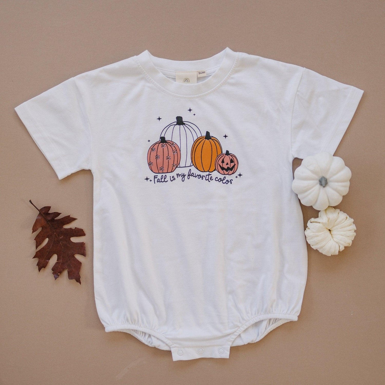 Organic cotton baby romper with screenprinted "Fall Is My Favorite Color" graphic across the front.
