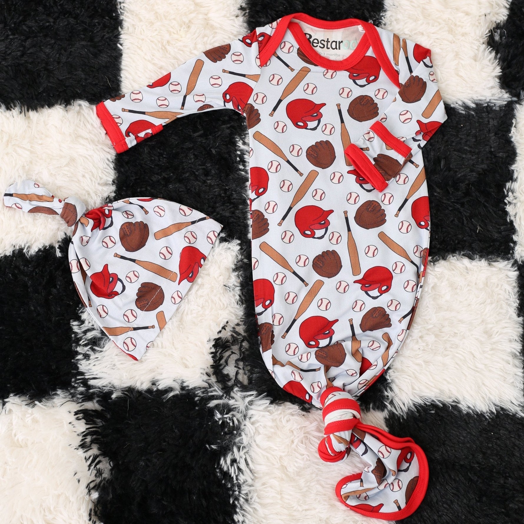 Baby gown and matching hat in a baseball fastball print with fold-over mittens and knotted bottom