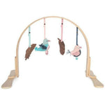 Modern Nursery natural wooden baby play gym with hanging toys.