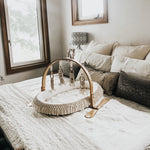 Modern Nursery Natural Play Gym, sustainable wood infant activity center.