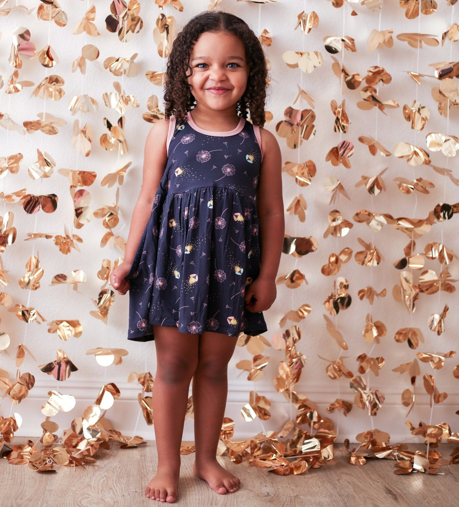 Toddler dress with firefly print, racerback shape and long sleeves in pink tones