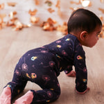 Footie pajamas with a fireflies print, full-length zipper, and covered feet