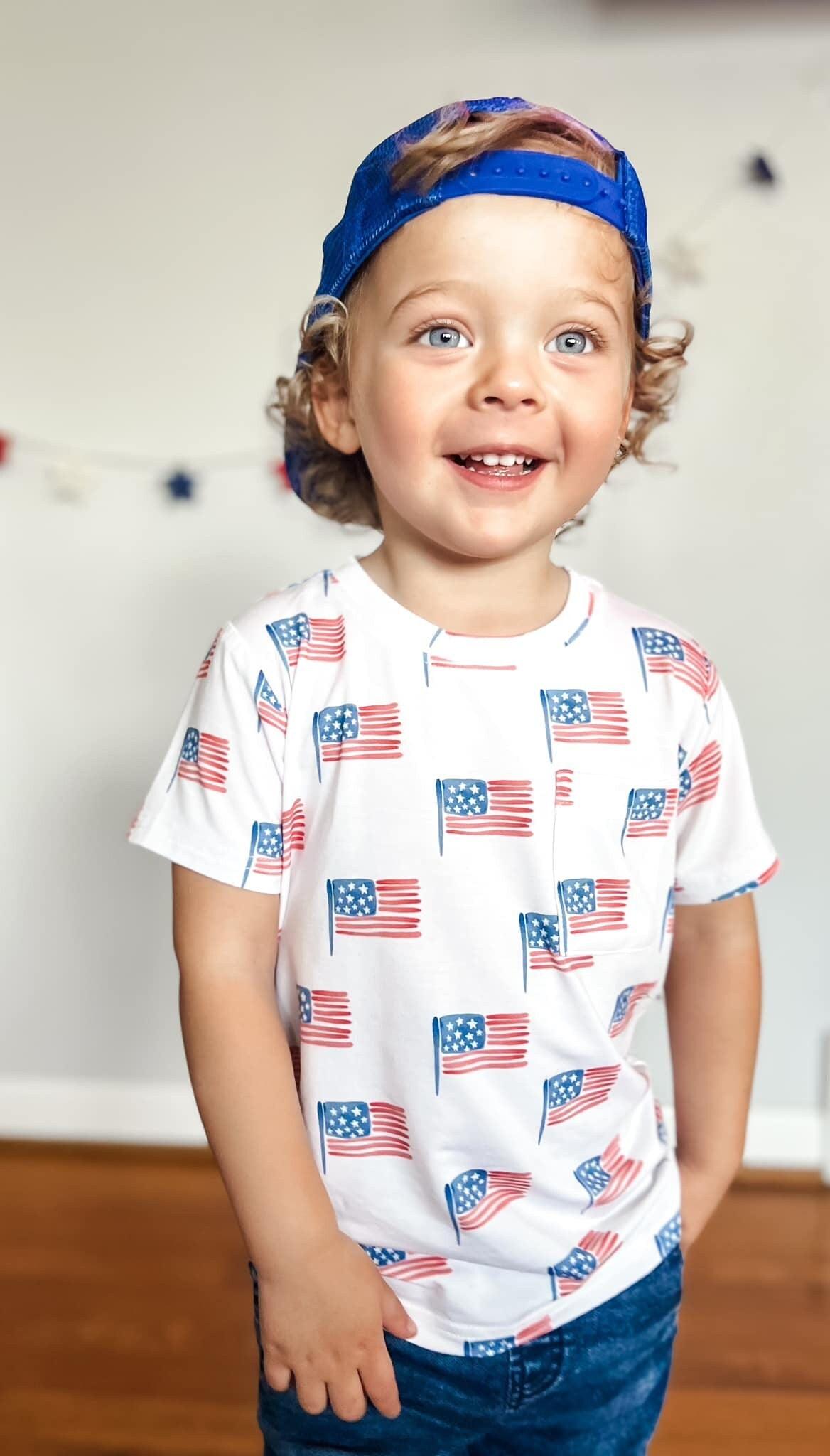 Baby wearing Little Joy Co bamboo flag print pocket tee and matching shorts set
