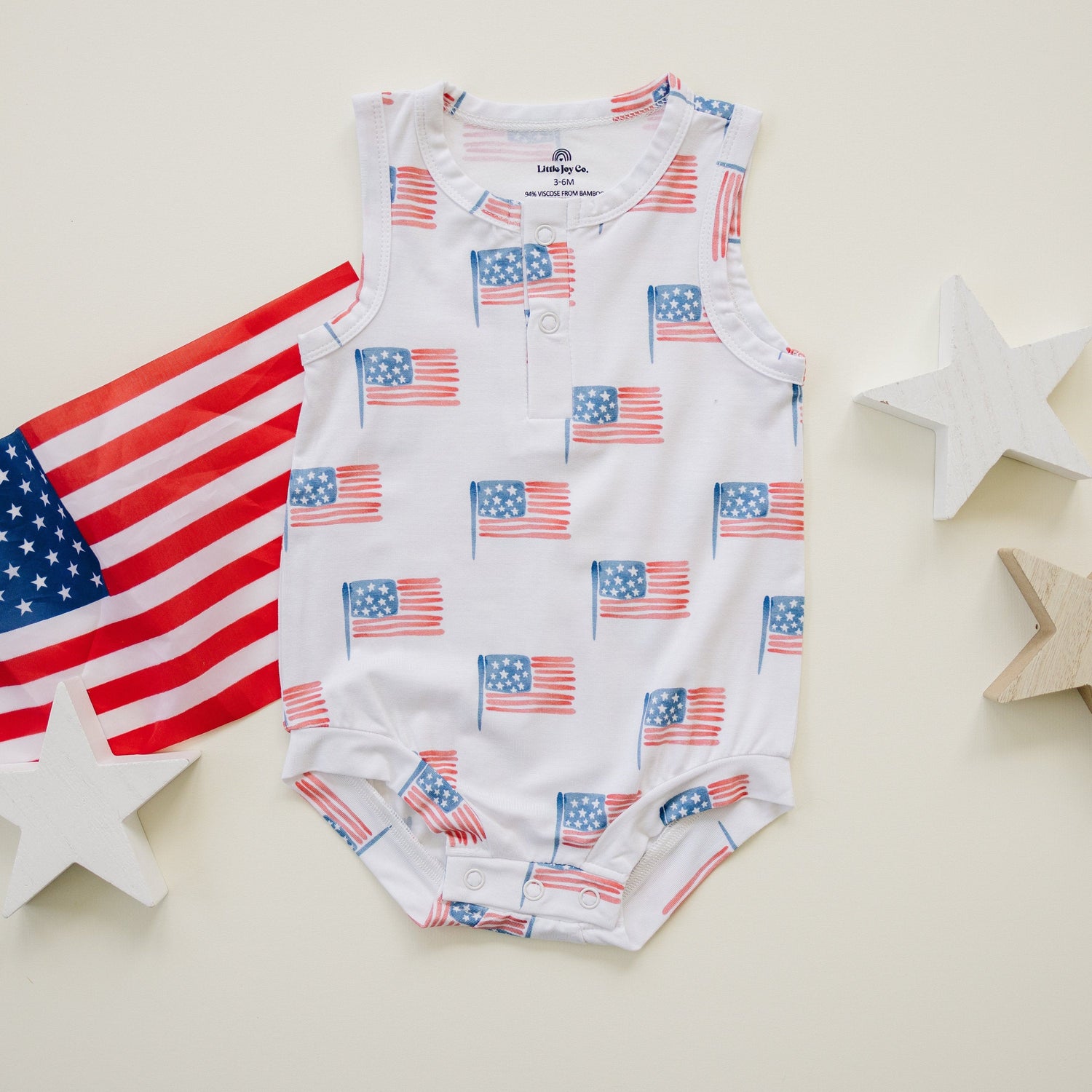 Little Joy Co. baby in a soft bamboo sleeveless romper, perfect for comfortable play and sleep.