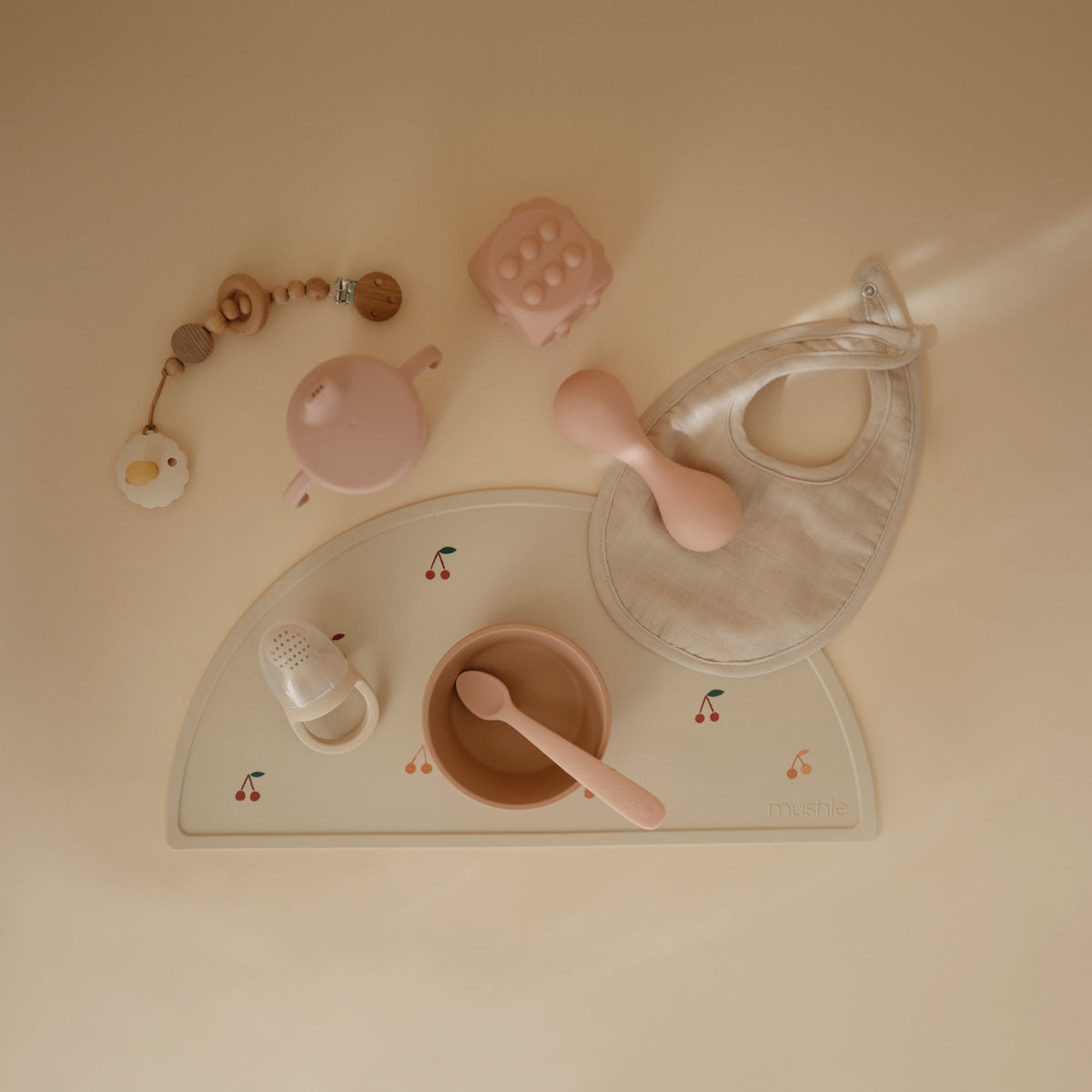 Mushie silicone placemat for babies, non-slip and easy to clean.
