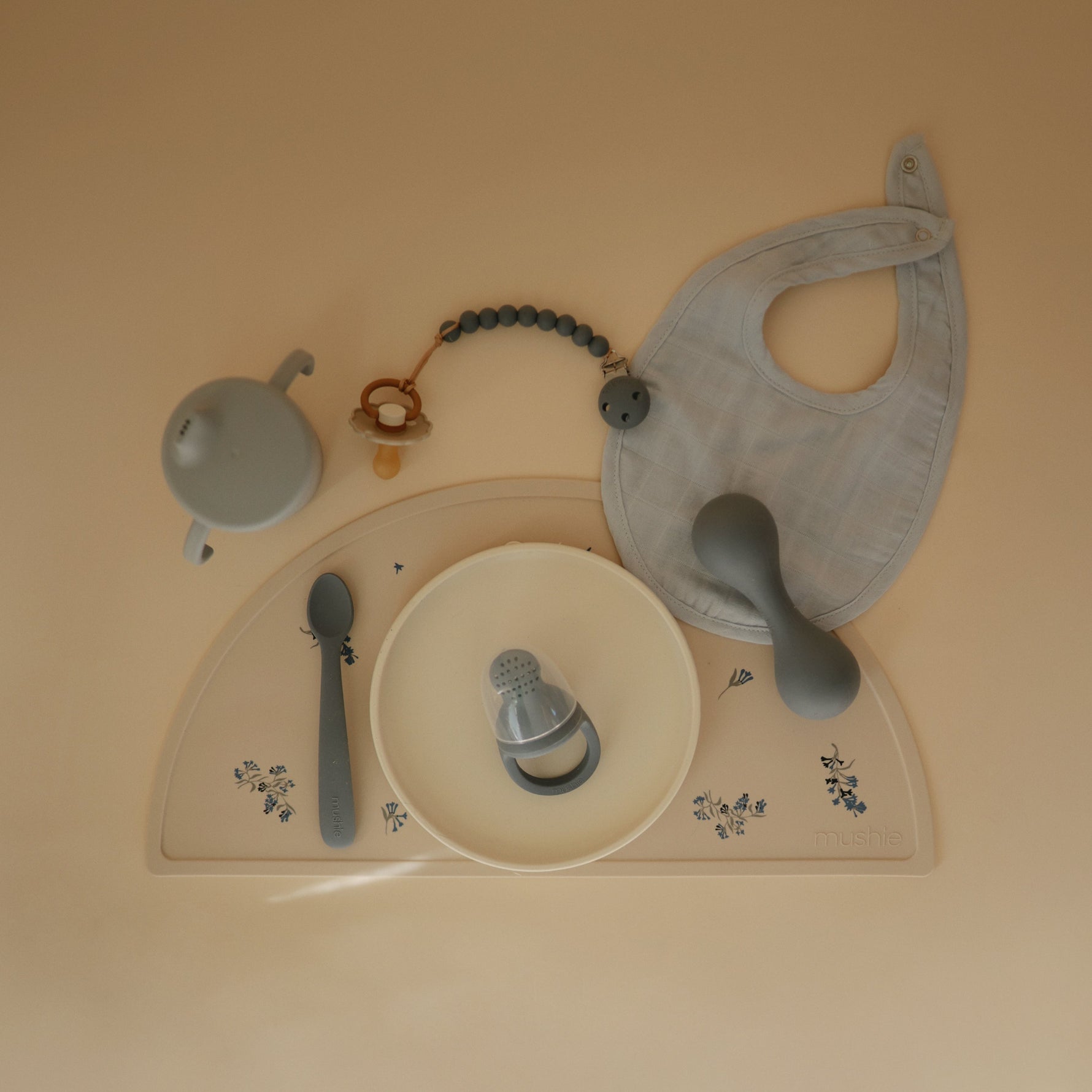 Mushie silicone placemat for baby, food-grade, non-slip, easy clean.
