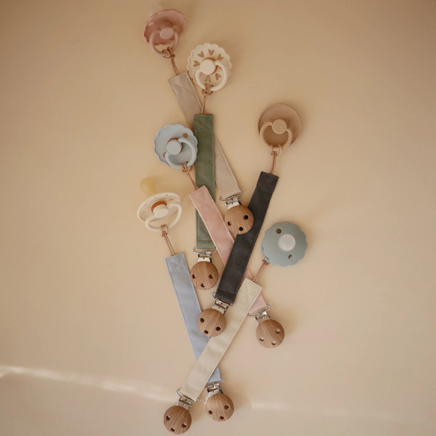 Linen Pacifier Clip Two Pack with Water Resistant Coating and Faux Wood Silicone Clasp Mushie
