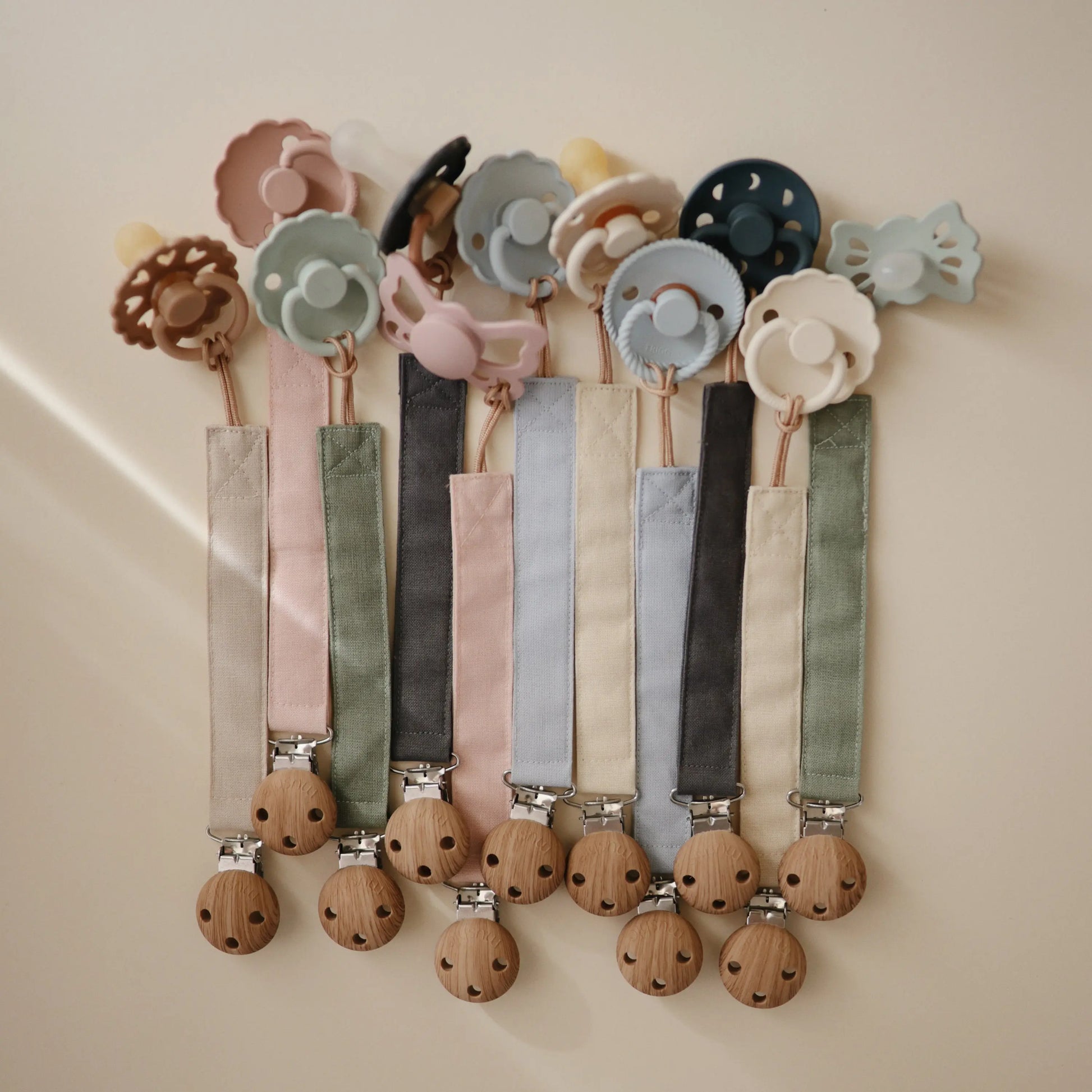 Linen Pacifier Clip Two Pack with Water Resistant Coating and Faux Wood Silicone Clasp Mushie