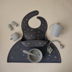 Mushie food-grade, non-slip silicone placemat for baby feeding.