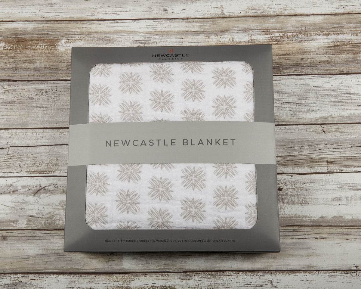 Soft organic cotton muslin baby blanket with a whimsical Flower Child floral print.