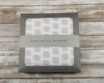 Soft organic cotton muslin baby blanket with a whimsical Flower Child floral print.
