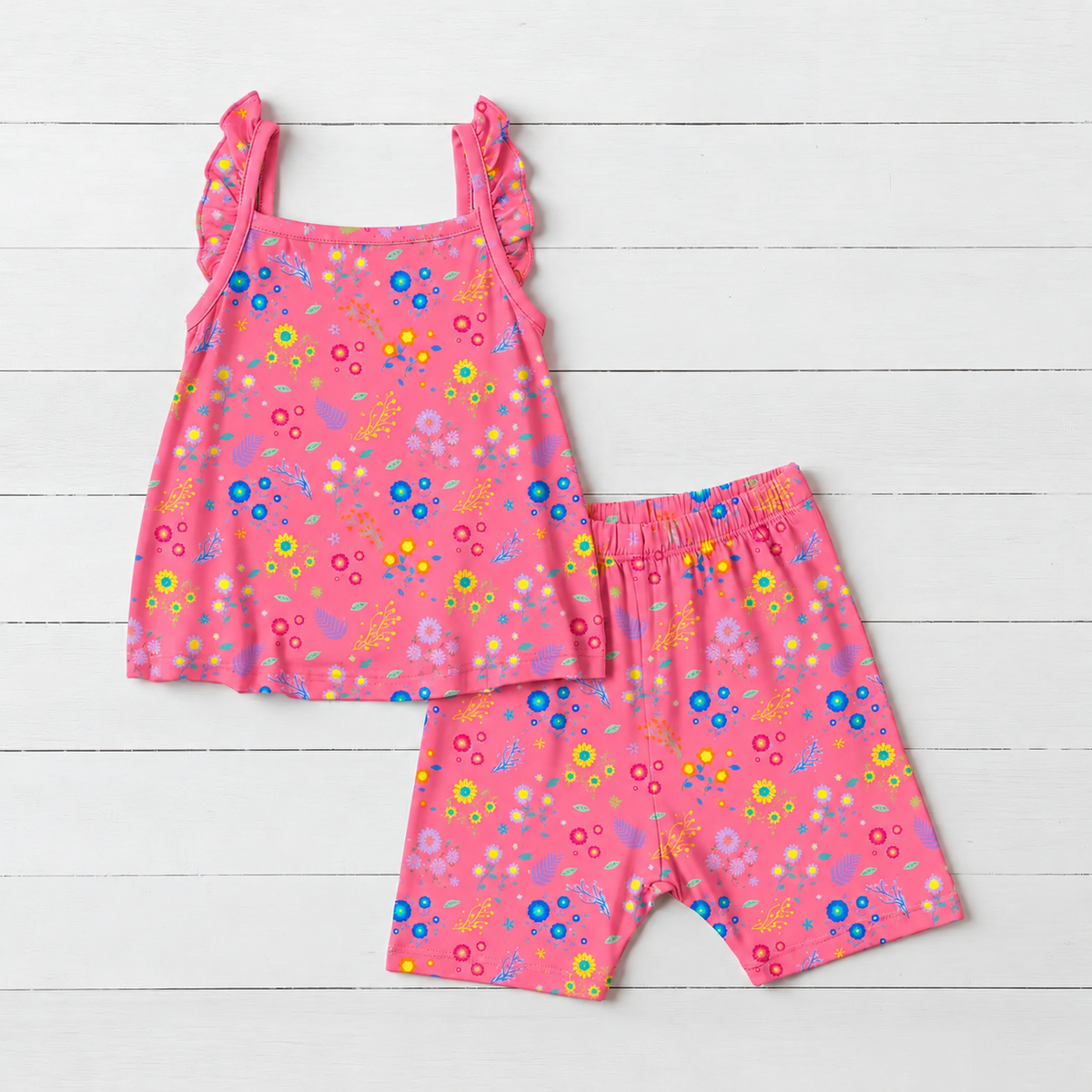 Baby flutter strap tank top and matching shorts in a flower confetti print on a white background