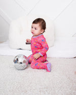 Baby footie pajamas in white with a scattered multicolor flower confetti print and front two-way zipper