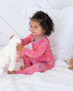 Two-piece long sleeve baby pajama set in a flower confetti print with matching pants