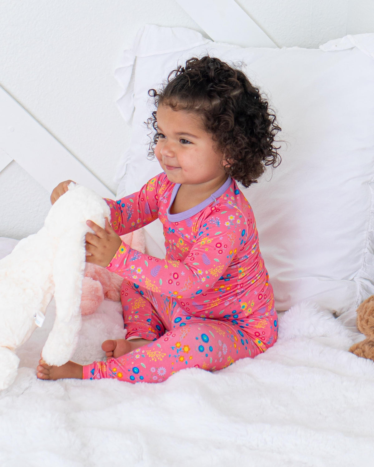 Two-piece long sleeve baby pajama set in a flower confetti print with matching pants