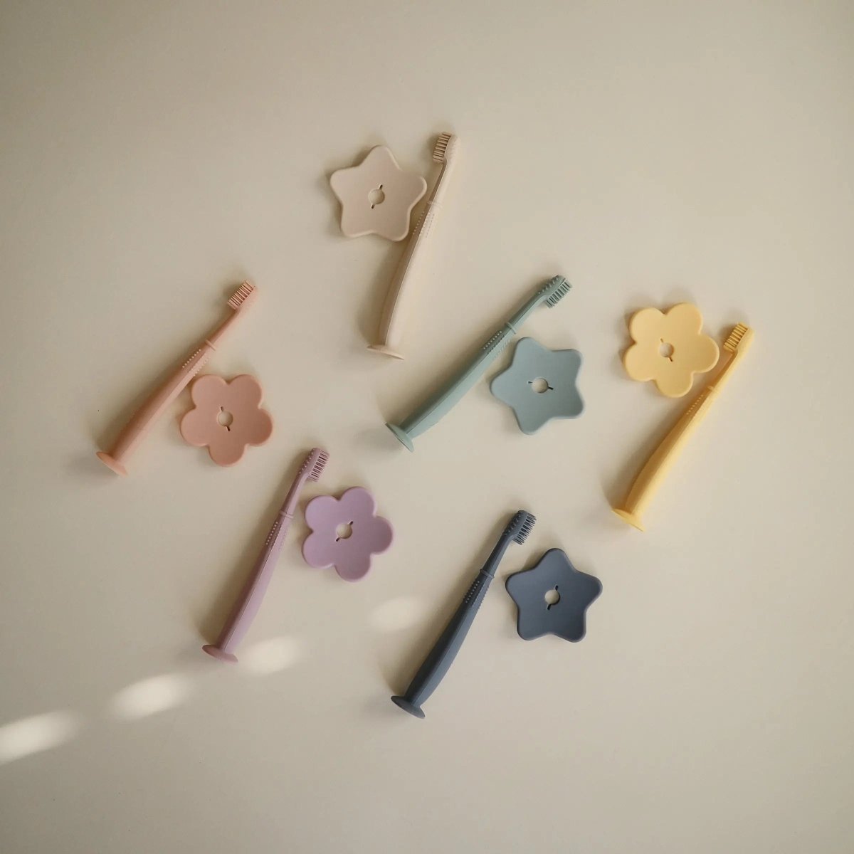 Mushie Flower Training Toothbrush for Kids - Soft Silicone Bristles for Gentle Cleaning and Gum Stimulation -