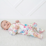 Footie pajamas in a pink floral and butterfly print with a full-length front zipper and covered feet.
