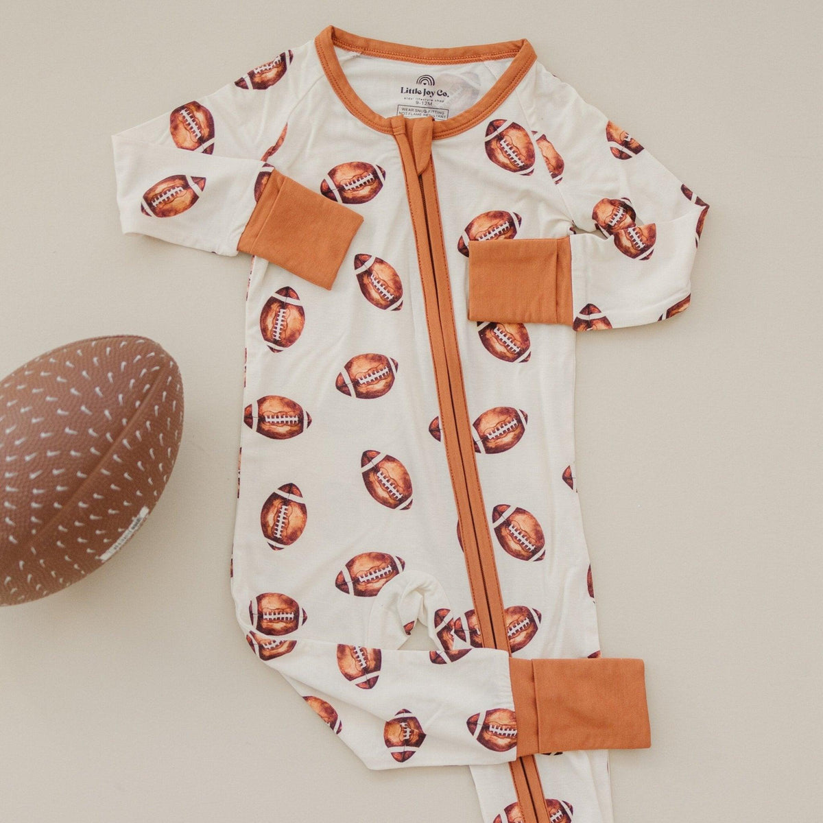 Football Print Bamboo Zippy Romper by Little Joy Co.