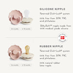 Two FRIGG Daisy silicone pacifiers in a 2-pack, featuring a charming daisy design and natural colors.