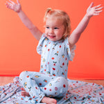 Flutter sleeve baby romper in a pink fruit print with dual front zippers.