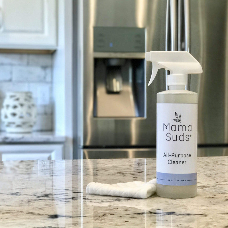 MamaSuds All-Purpose Cleaner Spray in a kitchen setting with a cleaning cloth, ideal for eco-friendly and non-toxic cleaning.
