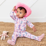 Baby footie pajamas with an all-over western cowgirl boot print and a full-length front zipper.