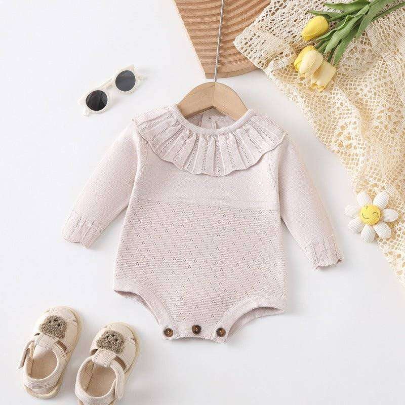 Girl long sleeve onesie with scalloped neck design, perfect for style and comfort.