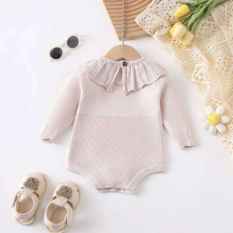 Girl long sleeve onesie with scalloped neck design, perfect for style and comfort.