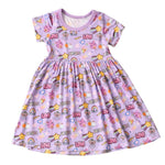 Girl Power dress in pink and white with smiley emoticon print and short sleeves