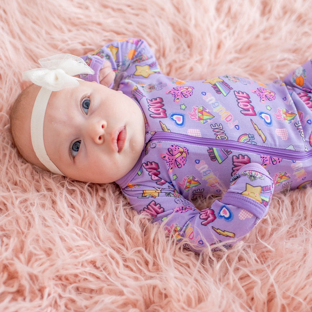 Purple baby footie pajamas made from bamboo fabric with a full-length front zipper and footed legs.