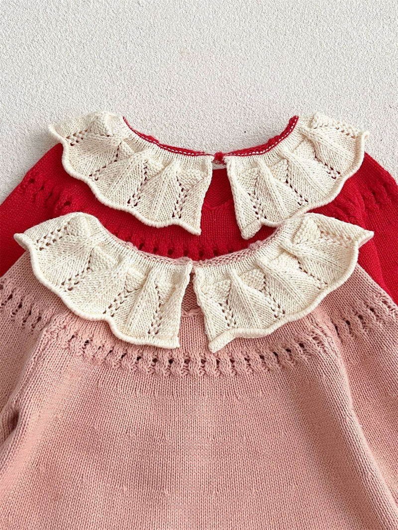 Girls comfortable scalloped design sweaters in red and pink with intricate lace detailing.