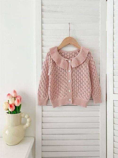 Girls comfortable hollow-out geometric sweater on a hanger.