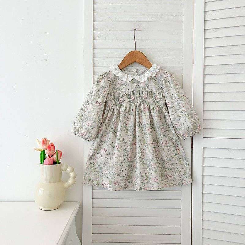 Girls long sleeves floral dress on hanger, elegant design, high-quality material.