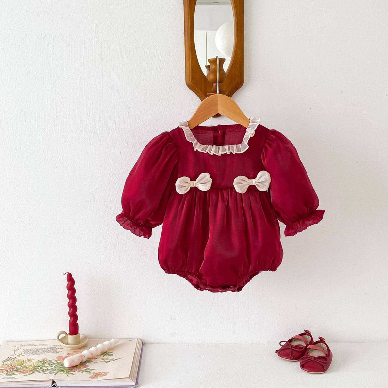 Girls long sleeves square ruffle neck top with bows on hanger.