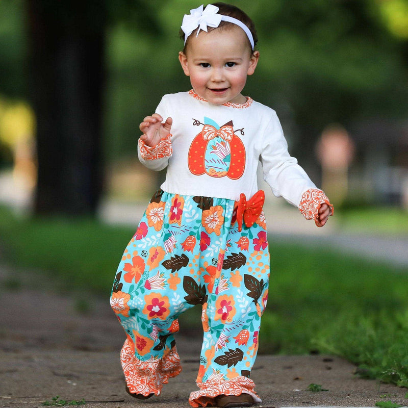 Girls Thanksgiving romper with orange pumpkin applique and fall floral print.