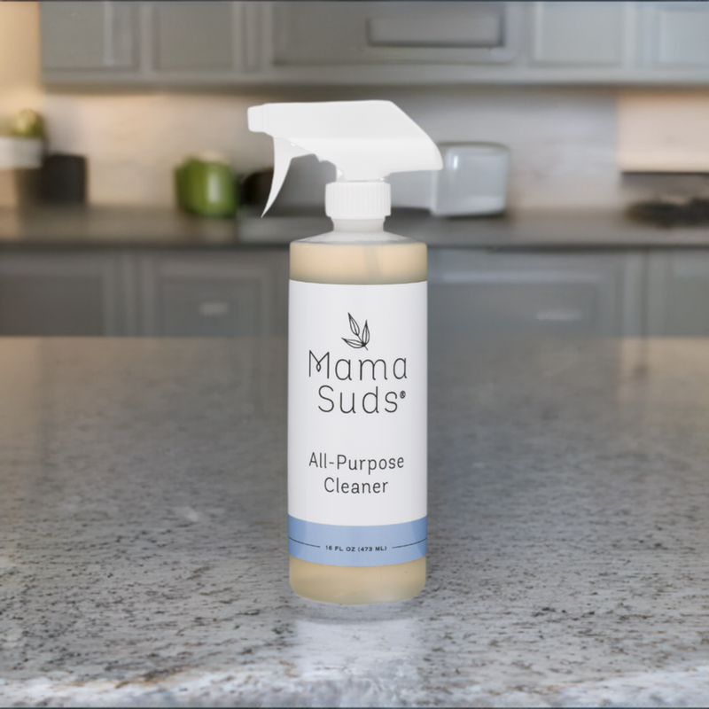 Eco-friendly all-purpose cleaner spray by MamaSuds on kitchen countertop.